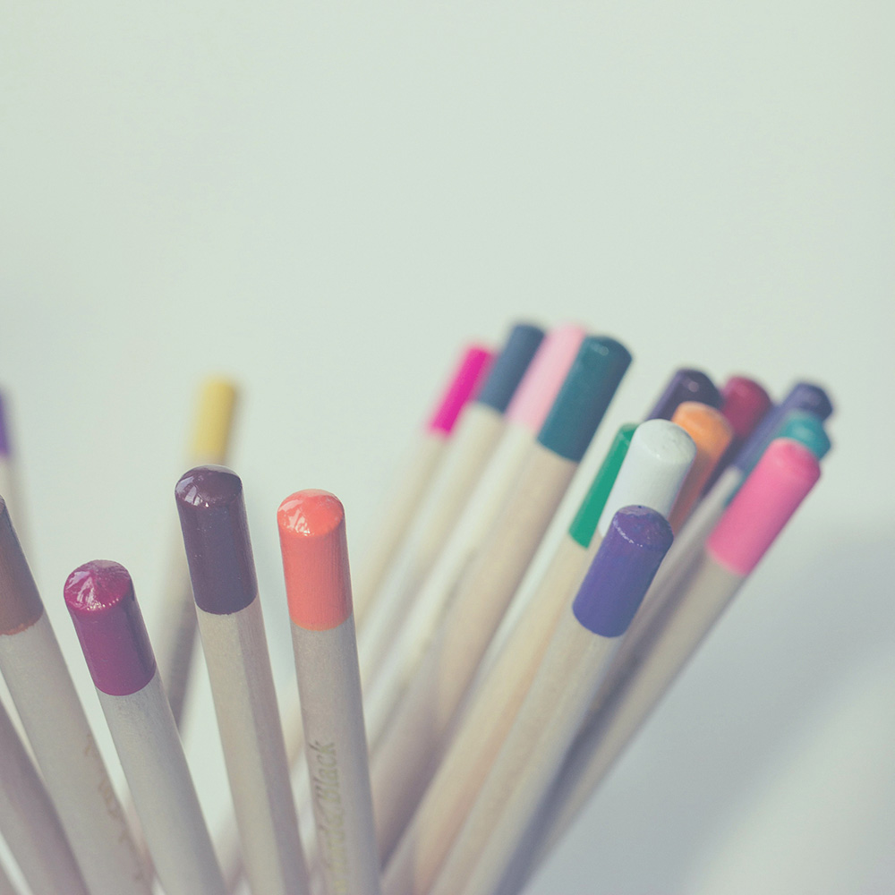 Close-up of wooden coloured pencils in various colors.